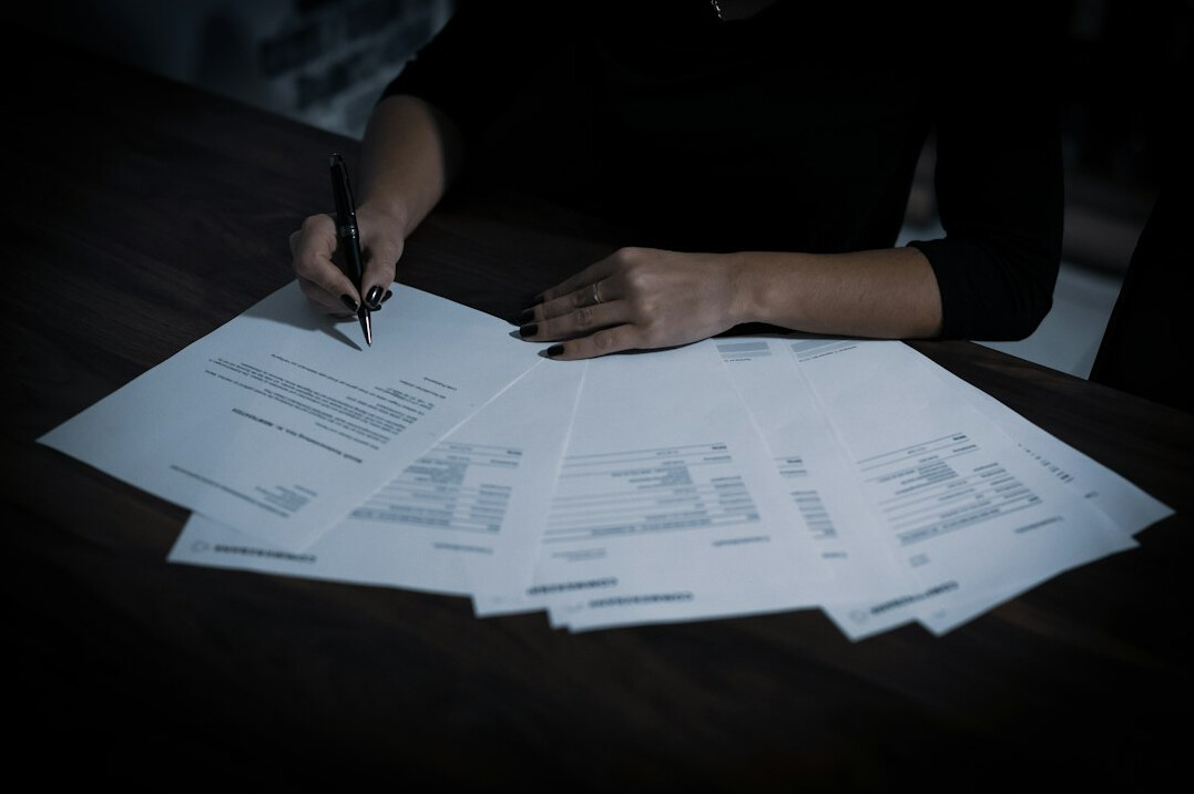 person signing insurance papers